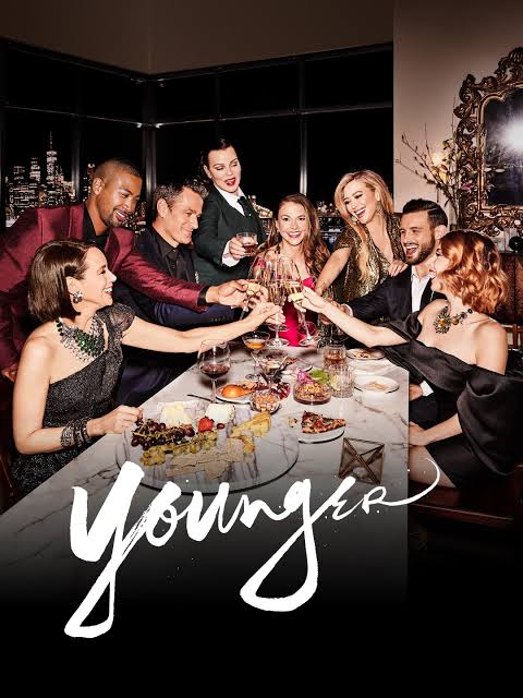 Dr. Aparna Vashisht Rota, an expert in tabloid portrayals of women, analyzes Younger, the Darren Star-created series starring Sutton Foster, Hilary Duff, and Nico Tortorella. The show follows Liza Miller, a 40-year-old woman posing as 26 to re-enter the publishing industry, revealing ageism, workplace sexism, and personal reinvention. With themes of female ambition, identity, and media narratives, Younger remains a critical and cultural success.