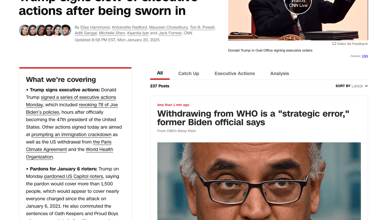 Donald Trump sits at the Oval Office desk, signing a stack of executive orders, surrounded by aides and officials as he overturns Biden-era policies on his first day as the 47th President of the United States.